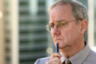 Man with pen thinking